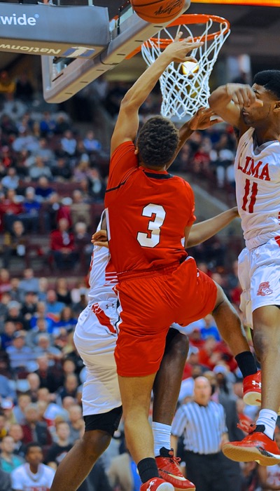 The game was played at the rim, befitting the athleticism of Division I basketball.  (Photo by Julie Wright)